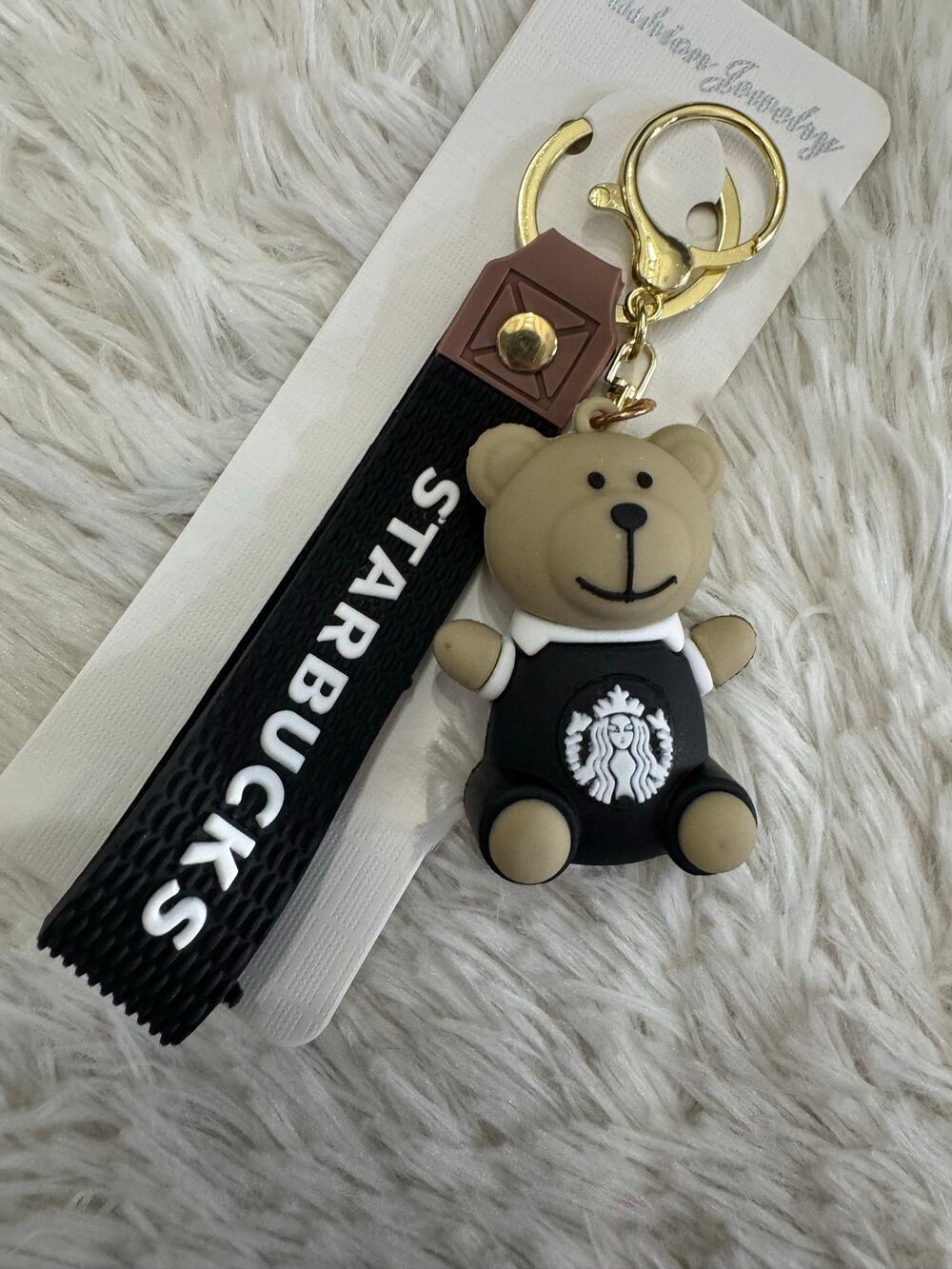 Starbucks bear black keychain with white sash and black Starbucks logo
